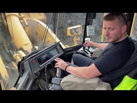 Caterpillar 990 Wheel Loader Loading Coal On Trucks 